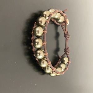 Brown leather bracelet, woven w beads throughout.